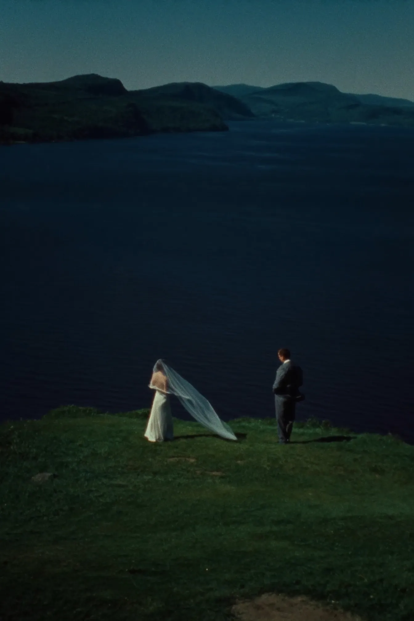 A couple eloping on a clifftop above the St. Lawrence River in Charlevoix