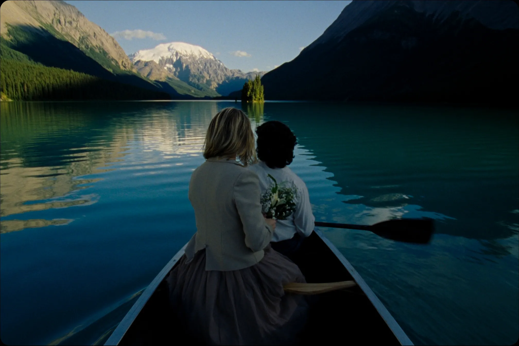 A couple in a canoe on Maligne Lake near Spirit Island in Jasper