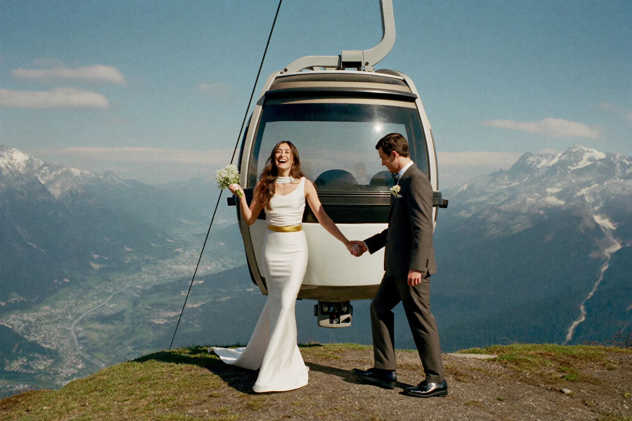 A couple inside the glass Peak 2 Peak gondola high above the Whistler valley